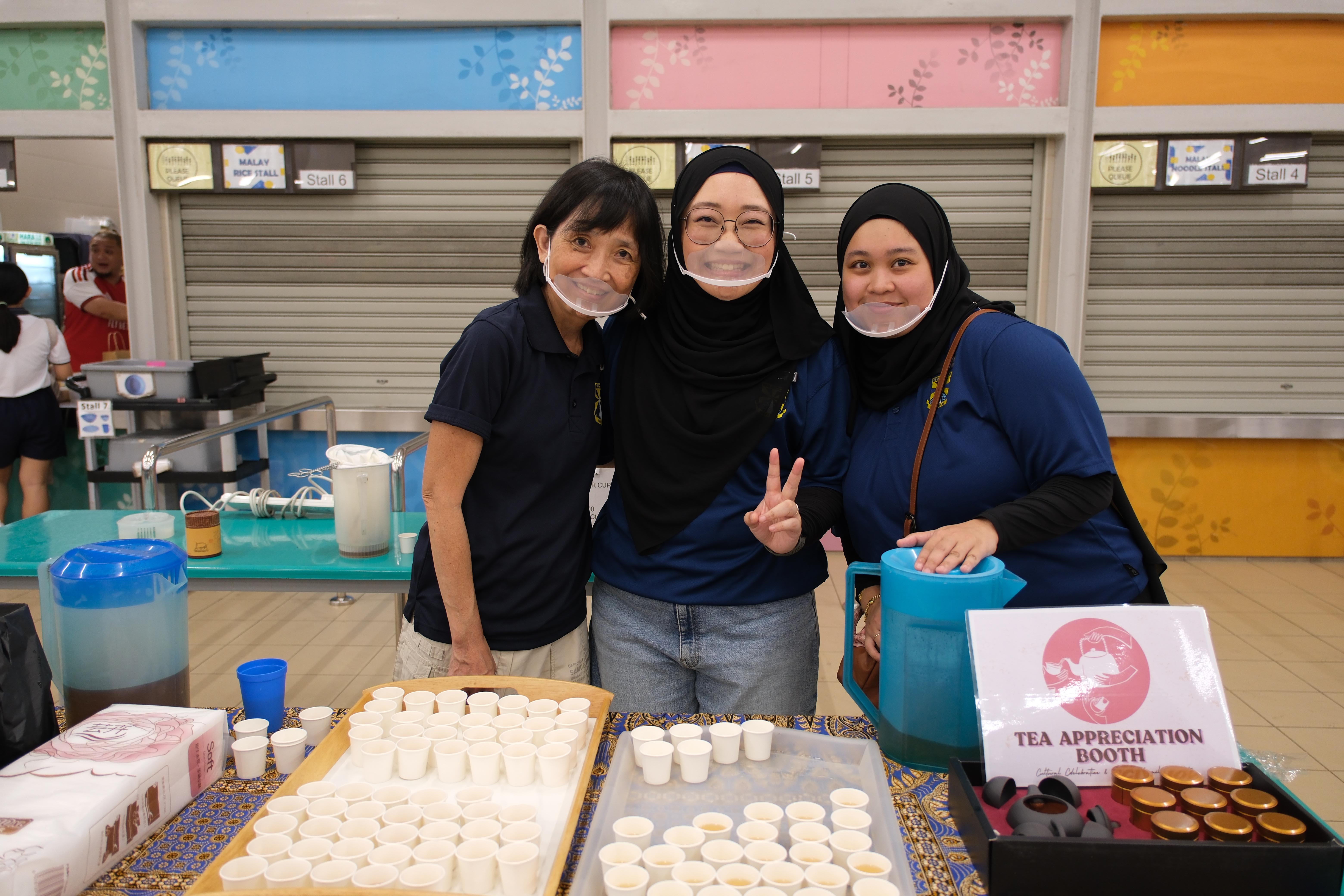 Tea-rific teamwork! Our cheerful team is all smiles and ready to serve up a warm cup of appreciation at the Tea Appreciation Booth.